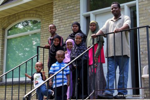 ADC Education Helps St. Cloud Family Purchase Home Somali family outside their newly-purchased home in St. Cloud, MN