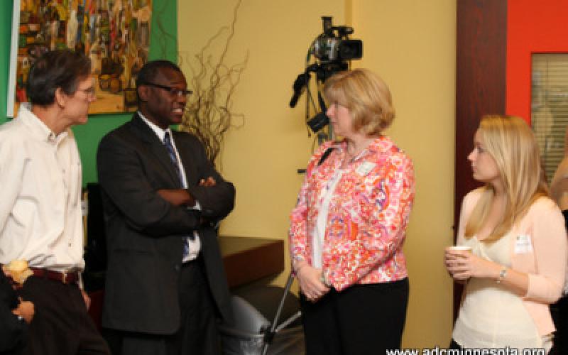 Participants chat after the breakfast roundtable