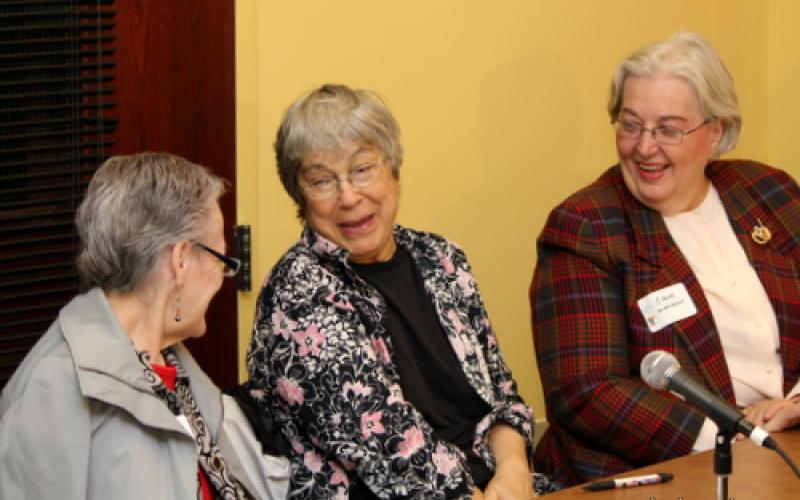 Participants laugh at table