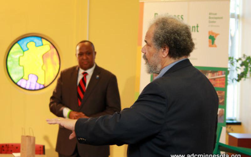 William Green speaks. Hussein Samatar looks on.